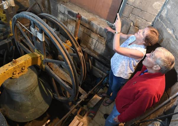 Heritage Open Day at Silk Willoughby Church. Bell Ringer Bruce Burman in the bell tower with Ruth Davies of Lenton. EMN-190916-173934001