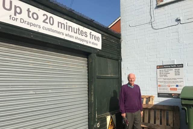 David Marvell by the sign that clearly says 20 minutes free. ANL-190916-180933001