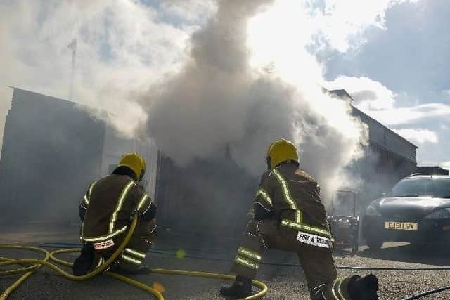 Firefighters demonstrate their new equipment at the Waddington training facility.