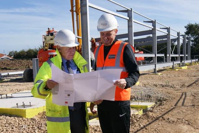 David Newton and Craig Elliott check out the plans.