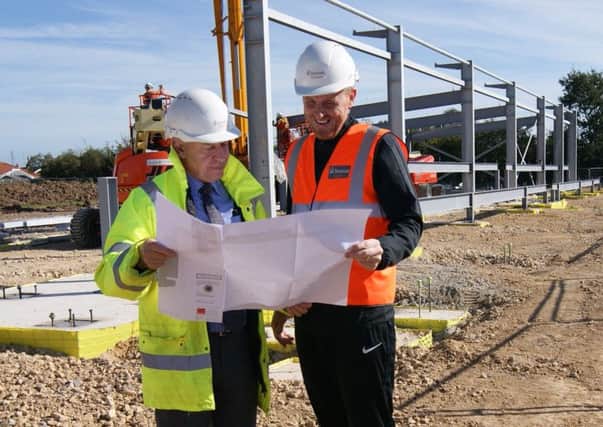 David Newton and Craig Elliott check out the plans.