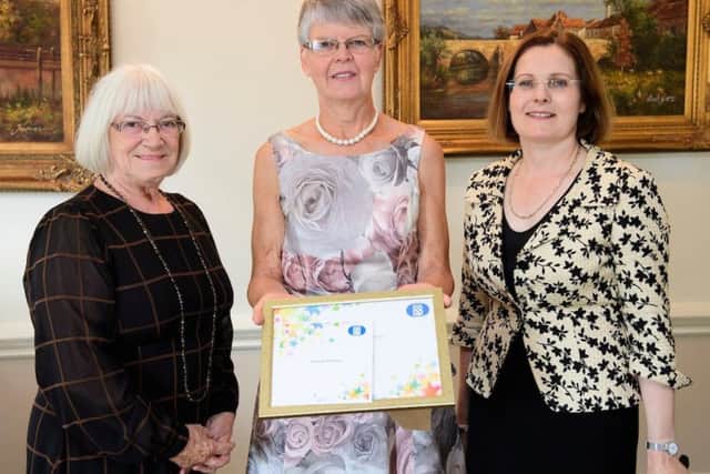 Lincolnshire Co-op vice president Margaret Tranter, left, and chief executive Ursula Lidbetter present a long service award to Deborah McKittonPicture: Chris Vaughan Photography for Lincolnshire Co-opDate: September 12, 2019 EMN-190920-065811001