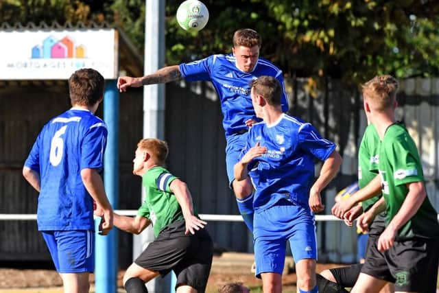 Stacy Cartwright heads clear during last week's FA Cup defeat.
