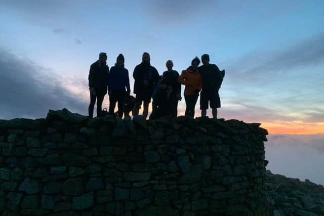 Sunset at the summit of Scafell Pike in the Lake District.
