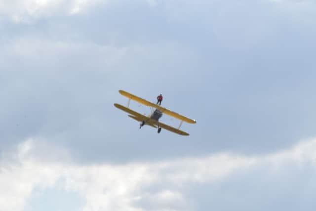 Sheila mid-flight standing atop the plane EMN-190923-182703001