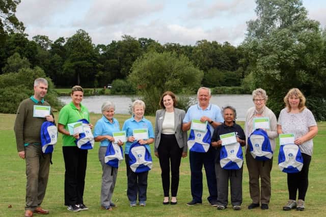 From left to right - Health walk winners Chris Dorrington, Greenwich Leisure Healthwise Coordinator Bev Dawson on behalf of winner Sheila Grossmith, Margaret Smith and Sue Wright, Lincolnshire Co-op Chief Executive Ursula Lidbetter, and other winners Ken Taylor, Shirley Thompson, Jan Barratt and Caroline Moore.