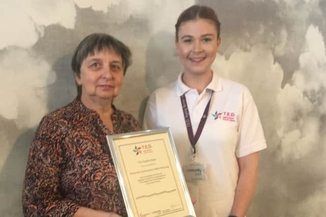 Hilary Harris, left, receiving the TED certificate by Roisin Mullee EMN-190930-115401001