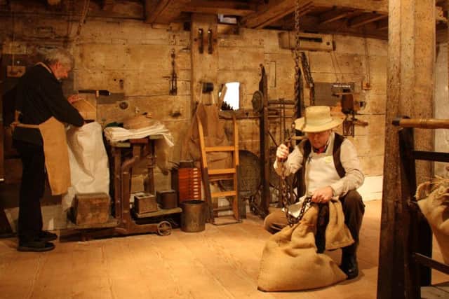 Millers at work at one of Sleaford's historic attractions - Cogglesford Watermill.