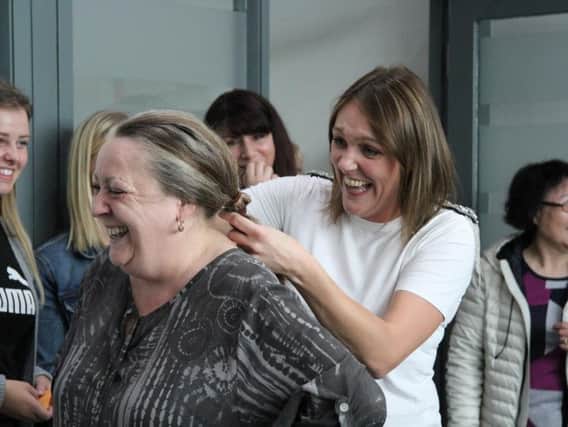 Lisa Willard, a Legal Secretary at Hodgkinsons Solicitors, won the chance to cut the hair of her colleague Amanda Smith for charity.