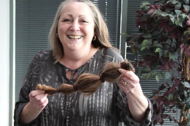Amanda Smith - a Personal Injury Lawyer atHodgkinsons Solicitors - cut 13 inches off her hair for the Little Princess Trust.