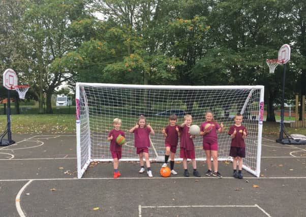 Pupils at Kelsey Primary School are giving the thumbs up to their new sports equipment EMN-190610-135831001