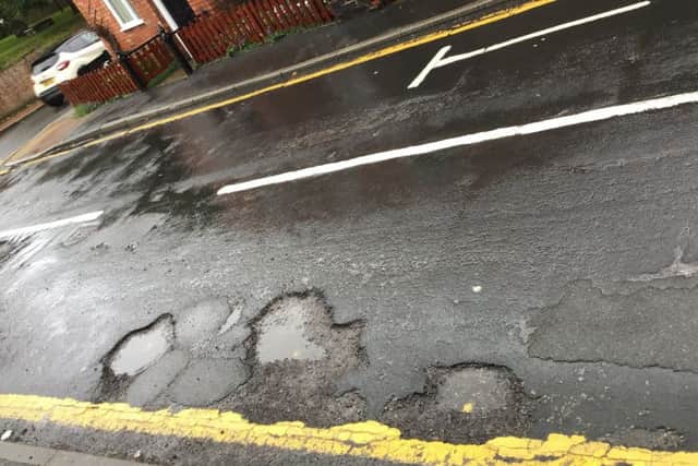 Pot holes in Market Rasen's Church Street EMN-190110-062244001