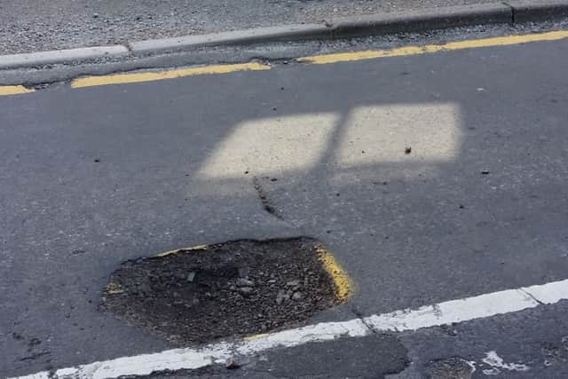Pot holes in Market Rasen's Church Street EMN-190110-062221001