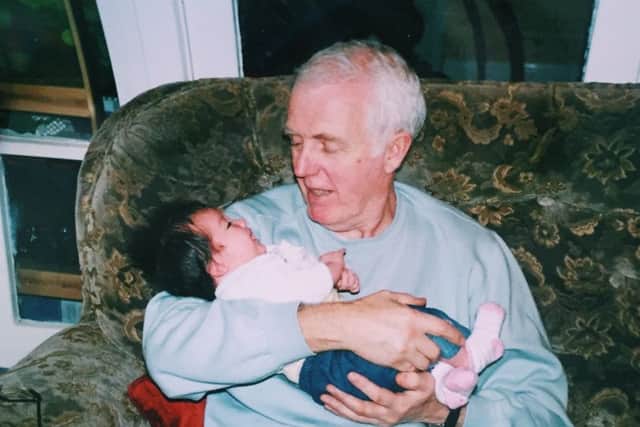 Molly cradled by her grandad Leo when she was just a baby.