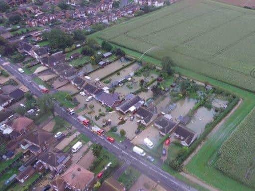 An overhead view of the flooded properties at Westcliffe Road, Ruskington, taken by a police drone.