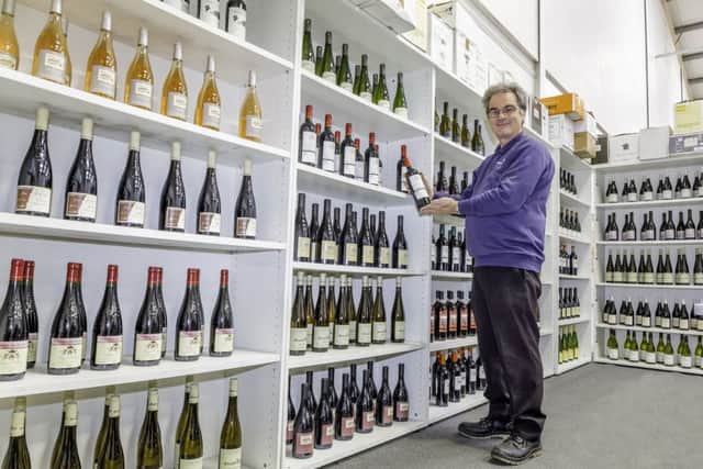 The saleroom's Kevin Burr with the wine.