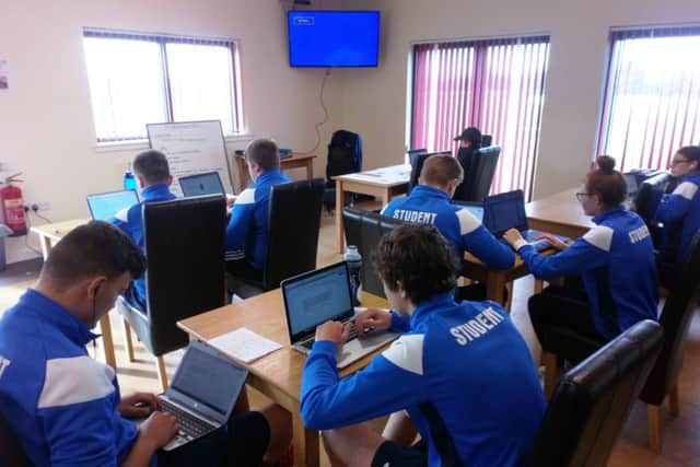 Heads down: Some of the students taking the diploma run by JB Sports Coaching at Horncastle Town Football Club