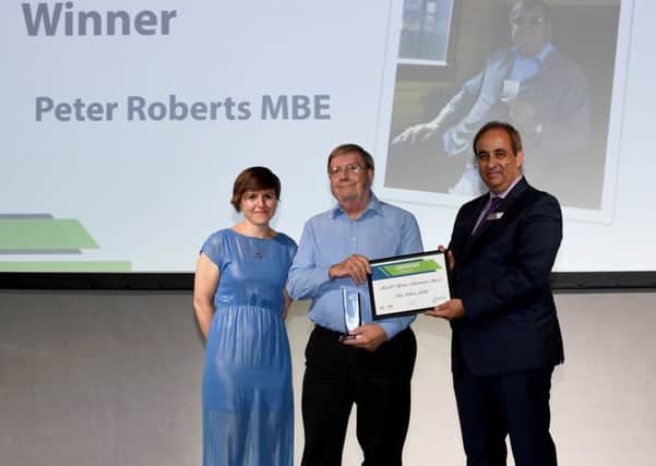 Peter Roberts MBE receiving the ACoRP Lifetime Achievement Award from ACoRP chief executive, Jools Townsend (left) and managing director of West Midlands Trains, Jan Chaudhry van der Velde (right). EMN-190410-174410001