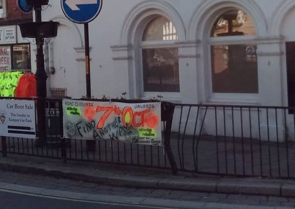 A banner in Sleaford Market Place announcing the upcoming Extinction Rebellion event. EMN-190410-181356001