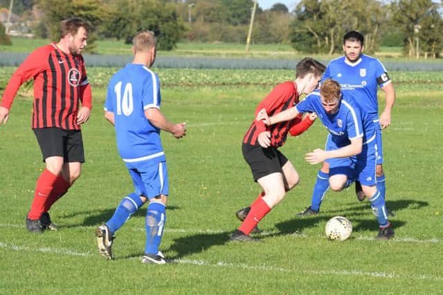 Benington (blue) v Woodhall Spa Res (red). Bayley Nicholson (blue), Sam Emerson (red)
