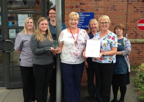 New Coningsby Surgery celebrate their award.