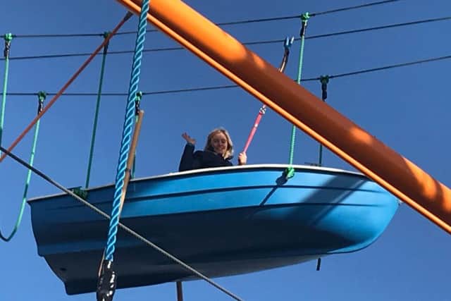 Hannah Mackay waving from Altitude 44.