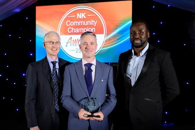 Contribution to a Better Environment award winner Ian Callaghan (centre).