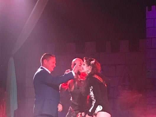 Mayor Coun Mark Dannatt removes a nail from the nose of a character in the Circus of Screams show at Fantasy Island.