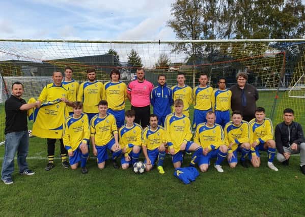 Sponsor Paul Ryan with the new-look Market Rasen Town first team EMN-191014-125920002