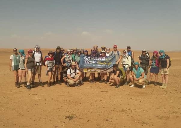 Weve done it! Sue and her fellow trekkers after completing their fundraising walk across the Sahara