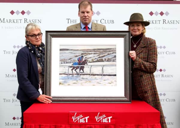 Sally and Simon Jones pictured with Di Marshall (right) and the painting. Credit: Mick Atkins Photography