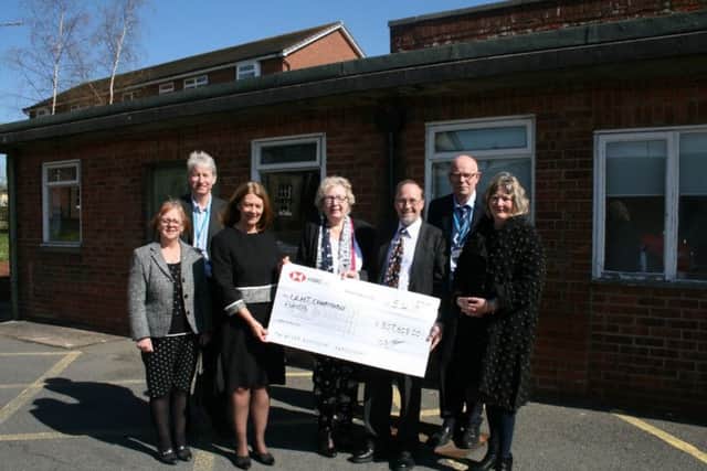 Chairman of the Louth Scanner Appeal, Trevor Marris, with other fundraisers presenting the cheque to ULHT Chair Elaine Baylis and other representatives from the Trust.
