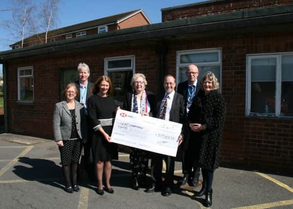 Chairman of the Louth Scanner Appeal, Trevor Marris, with other fundraisers presenting the cheque to ULHT Chair Elaine Baylis and other representatives from the Trust.