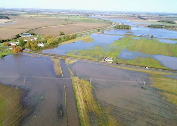 A photo of the flooded A631 road and many acres of farmland at Bishopbridge taken on Sunday. Picture: Julian Anyan EMN-191029-094355001