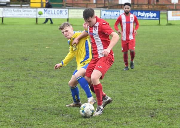 Rasen's Tom Robinson challenges Horncastle's Jonatham Timmins EMN-190411-094351002