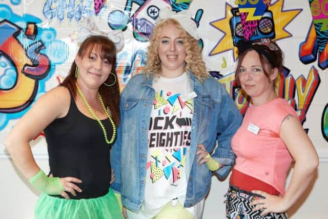 Back to the 80's for (from left) Sandpiper Care Home's Registered Manager Kelly Davies, Courtney Witney and Toni Harrison.
