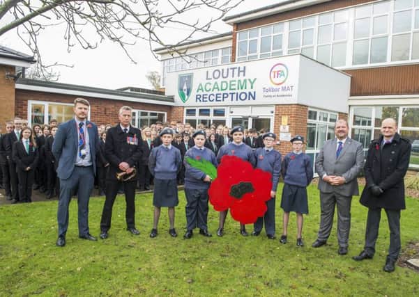Louth Academy Armistice Day: Two minute silence and The Last Post played by ex-RAF serviceman Peter Wood from Binbrook. (Picture: Sean Spencer/Hull News & Pictures Ltd).