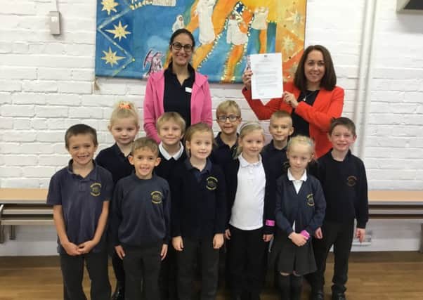 Executive head teacher, Becky Dhami, and Robin class teacher and phonic lead, Katie White, alongside some of the successful pupils.