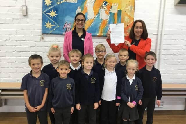 Executive head teacher, Becky Dhami, and Robin class teacher and phonic lead, Katie White, alongside some of the successful pupils.