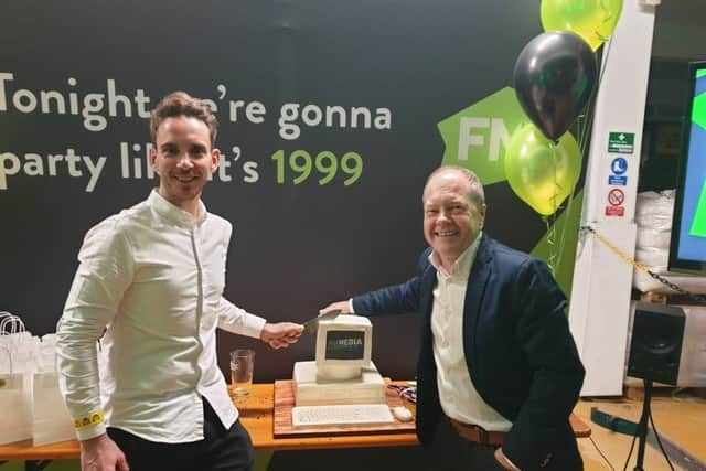 Ian Hargreaves and Shane Trail cutting the cake at First Media headquarters in Louth.