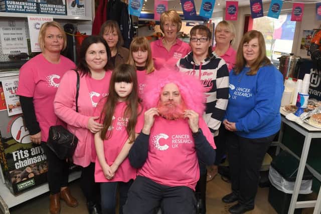 Simon Greenfield has his beard shaved off in aid of Cancer Research UK.