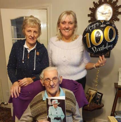 Frank 'Harold' Holmes celebrates his 100th birthday alongside daughters Sue Wilson and Sheena Mee.
