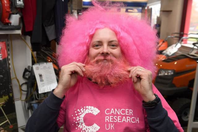 Simon Greenfield has his beard shaved off in aid of Cancer Research UK.