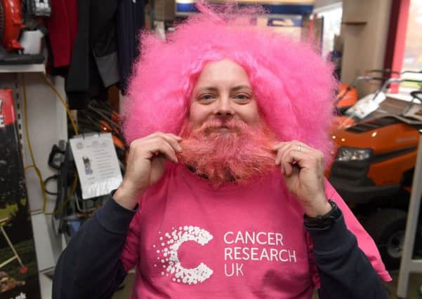 Simon Greenfield has his beard shaved off in aid of Cancer Research UK.