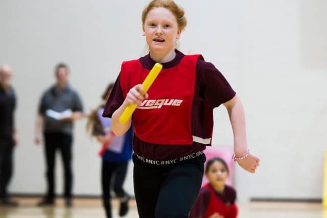 Lacey-Mai Saunders, of Binbrook Primary, sprints for the finish.
Picture: Sean Spencer/Hull News & Pictures EMN-191212-130008002