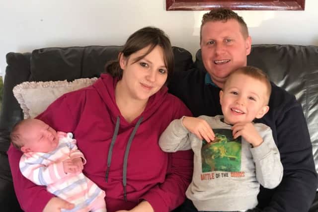 Baby Libby with parents, Fay and Stef Harrison, and brother Arlo Harrison.