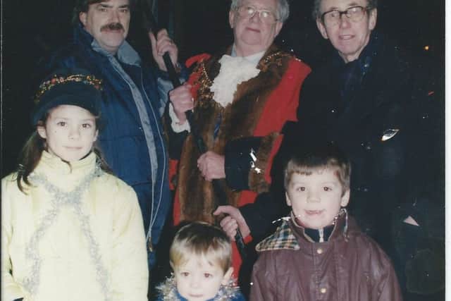 Lucy Young (7), George Young (5) and Charlie Young (2) helped the mayor to light the Millenium Beacon in Park Avenue, Louth.