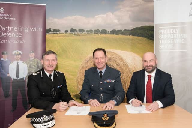 Signing the Armed Forces covenant, from left - Chief Constable Bill Skelly, Group Captain Gavin Hellard of the RAF and PCC Marc Jones. EMN-200901-153509001