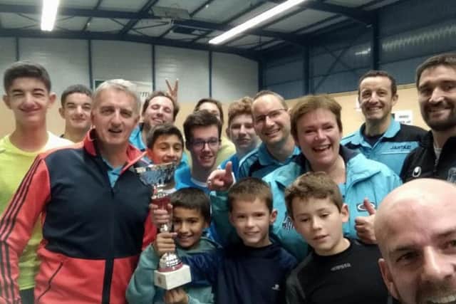 Lucy Yvart (fourth from right, in blue top) with other members of her team.