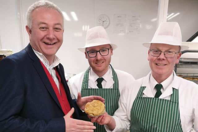 One of last year's guest judges, auctioneer Colin Young, pictured visiting Woolliss & Son in Louth. (Picture: Louth Pie Day)